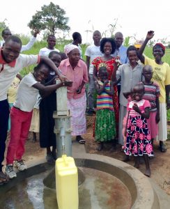 African women and children at a flowing well