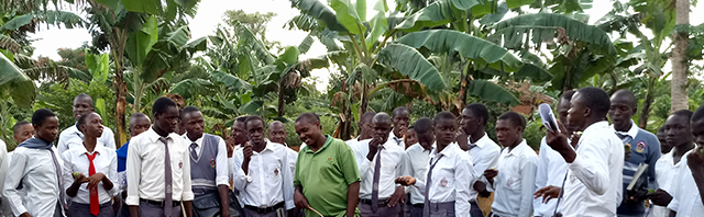 Dauson on Busoga farms with students